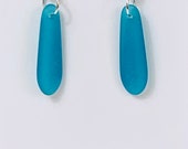 Teal sea glass earrings. tumbled beach glass. Petal. Tumbled glass. Beach wear. Ocean lover. Eco friendly. Sustainable. Fun. Beach
