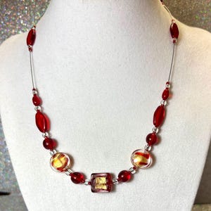 Red Genuine Swarovski Crystal “illusion” Tosca necklace. Formal necklace.  necklace. Red and gold necklace. Red and gold Tiger striped coins