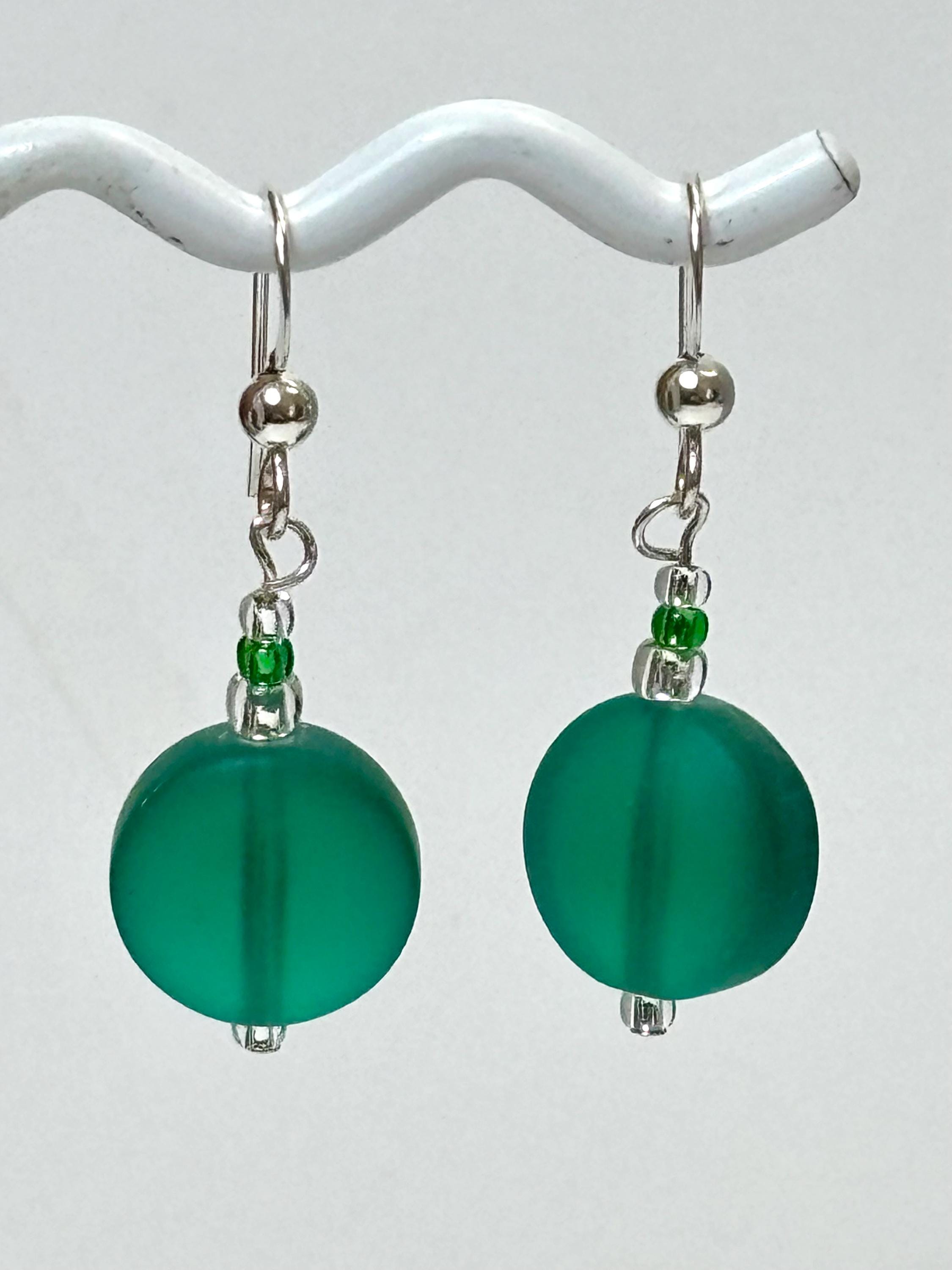 Emerald green Lentil shaped recycled sea glass style earrings on sterling French hooks. Beads are recycled tumbled beach glass.