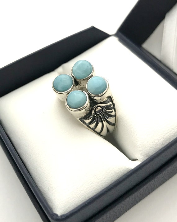 Unique high-grade larimar four-stone ring with inc