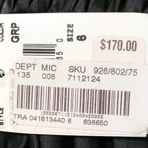 May include: A white tag with the brand name "ADRIANNE PAPELL" and product information. The tag includes the size "6", a department code, and a SKU number. The price is $170.00.