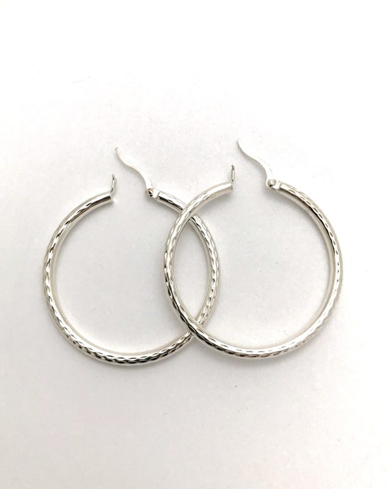 Textured sterling silver hoop earrings