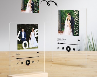 May include: A clear acrylic photo frame with a wooden base. The frame features a wedding photo and a music player design with play, pause, and skip buttons. The text "Better" and "Mais je t'aime" are visible on the frame.