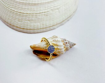 Blue round center and gold ring band
