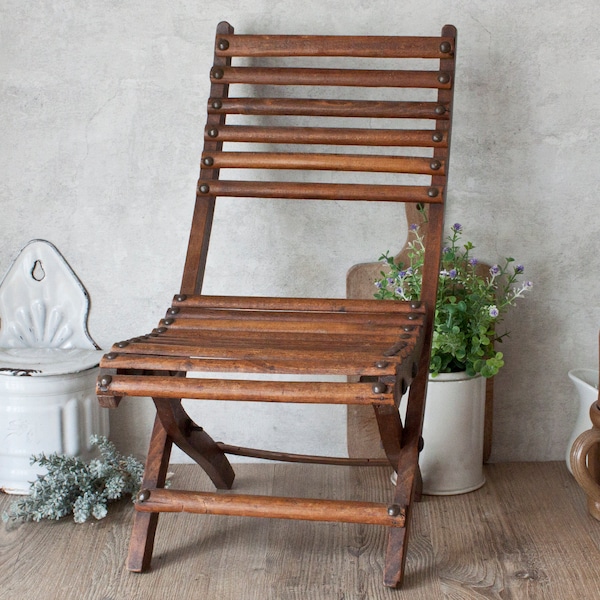 Chaise pliante enfant en bois teinté