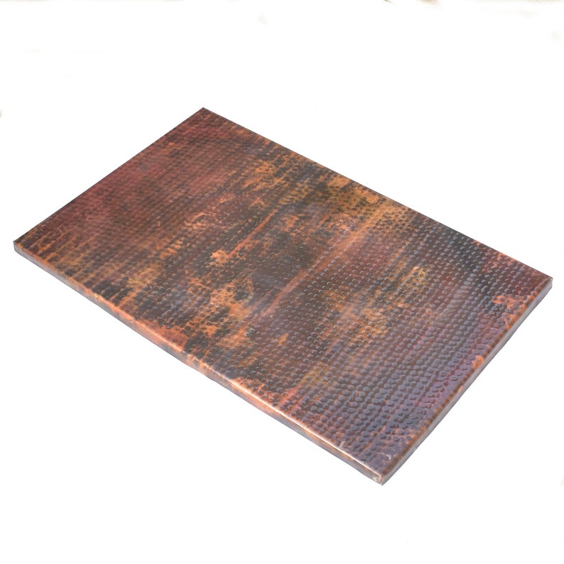 May include: A rectangular copper sheet with a hammered finish. The sheet has a warm, reddish-brown color with a patina finish.