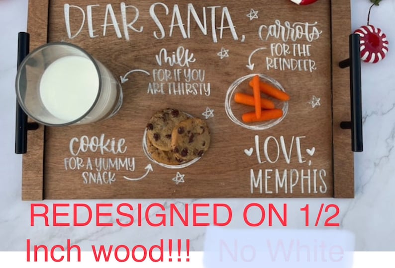 May include: A wooden tray with the words "Dear Santa" written on it. The tray is decorated with white paint and includes a glass of milk, cookies, carrots, and the words "Love, Memphis".