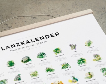 May include: A white poster with the title "FLANZKALENDER" and the subtitle "Voranzucht, Aussaat & Ernte". The poster features a calendar for each month of the year with a watercolor illustration of a different vegetable for each month.