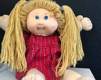 cabbage patch doll with teeth