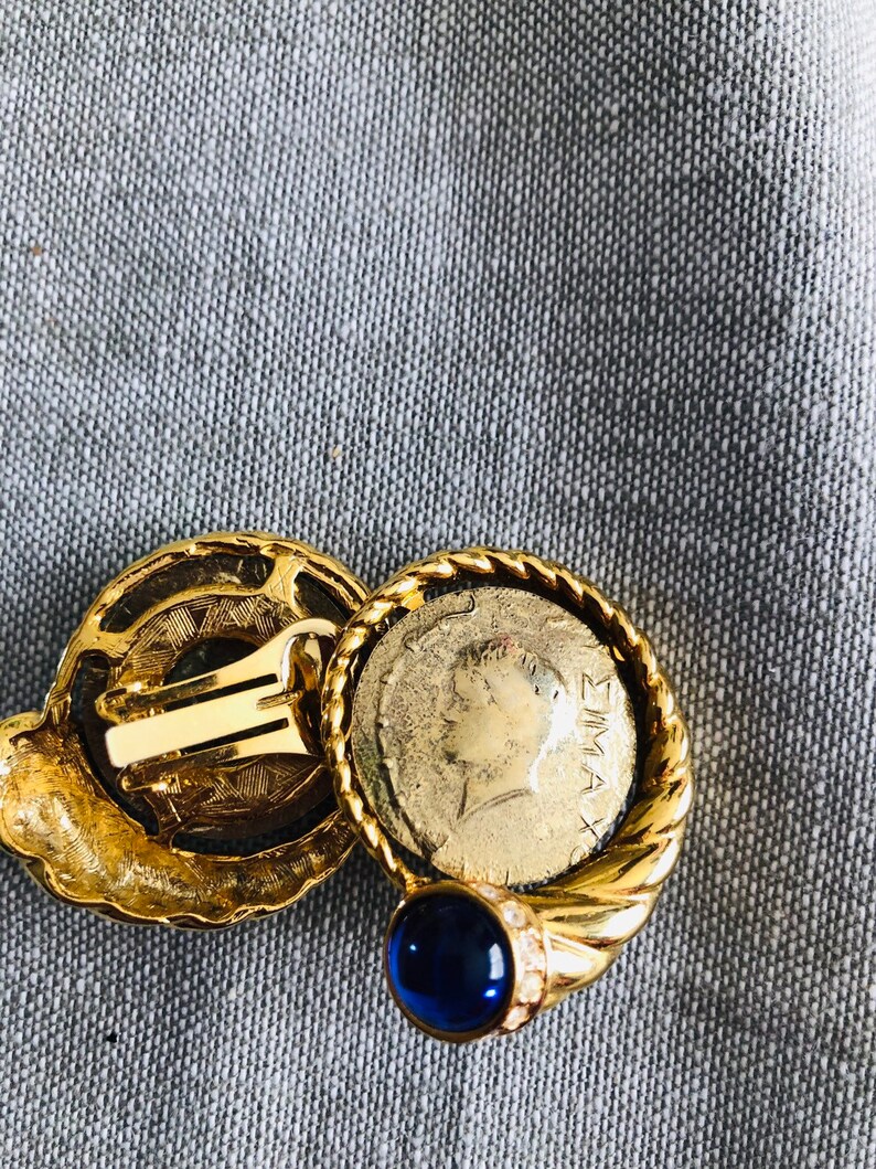 Gold Tone Greek Coin With Blue Jewel Clip on Earrings