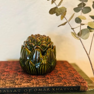 May include: A rustic wooden sign with the text "Welcome to our home" in white lettering. The sign features a distressed finish and a simple, inviting design, perfect for entryway decor.