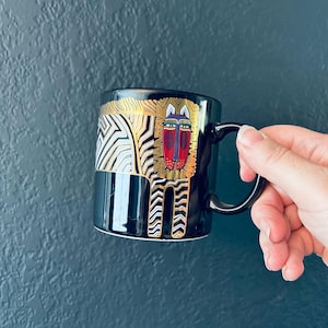 Taza de café Laurel Burch 1988 con diseño de cebra y tesoros antiguos, Japón, león dorado, negro, safari de los 80 en África