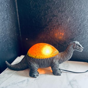 Cheyenne dinosaur nightlight glass and metal Lamp Sculptured 15” length 3 lbs