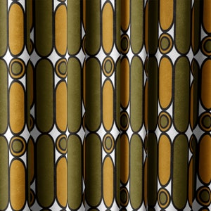 May include: A fabric with a repeating pattern of green and gold ovals with black outlines. The ovals are arranged in vertical rows and are separated by white circles with black outlines.