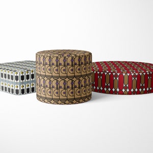 May include: Three different patterned cushions, one square, one round, and one cylindrical. The square cushion has a black and white geometric pattern with yellow accents. The round cushion has a red and brown geometric pattern. The cylindrical cushion has a brown and beige geometric pattern with purple accents.