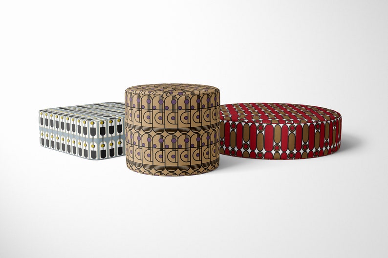 May include: Three different patterned cushions, one square, one round, and one cylindrical. The square cushion has a black and white geometric pattern with yellow accents. The round cushion has a red and brown geometric pattern. The cylindrical cushion has a brown and beige geometric pattern with purple accents.