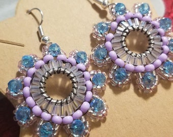 Flower dangle earrings, pale purple and clear glass seed beads with light blue glass bead with stainless steel wire. Handmade.