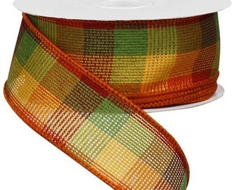 May include: A spool of decorative ribbon with a plaid pattern in shades of green, yellow, and orange. The ribbon has a wired edge in a darker orange color. The ribbon is ideal for crafts, gift wrapping, and seasonal decorations.