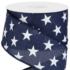 May include: A roll of navy blue and white ribbon with a white star pattern. The ribbon is 2.5 inches wide and is perfect for crafting and decorating.