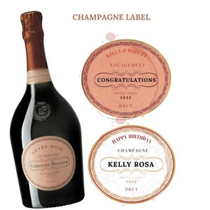 May include: Champagne bottle label template with a pink and gold design. The label says "Kelly & Robert Engagement Congratulations Maison Fondée 2025 Brut". There is also a second label that says "Happy Birthday Champagne Kelly Rosa Maison Fondée 2025 Brut".
