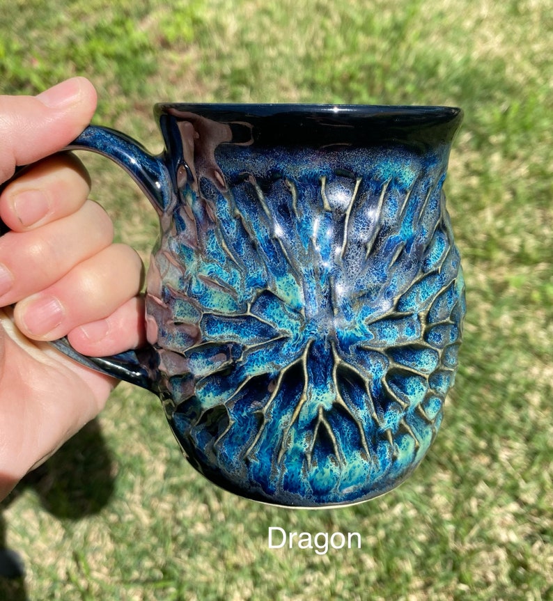 handmade pottery mug carved by hand