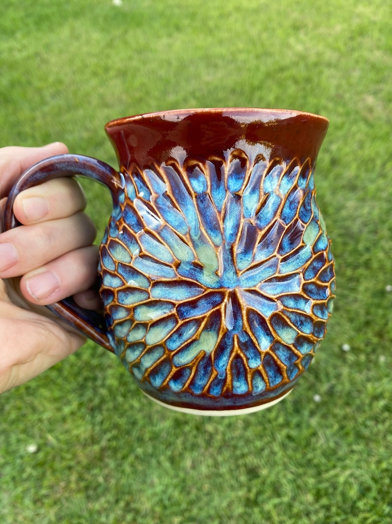 handmade pottery mug carved by hand