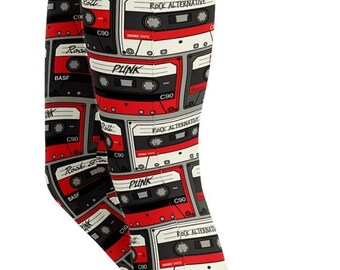 May include: Full-length leggings patterned with repeating red, black, and white cassette tape designs. The leggings feature the words "Punk" and "Rock Alternative" on the cassette tape designs. The leggings are a full-length style.