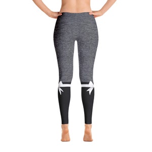 May include: Grey leggings with a black and white bow detail at the bottom of each leg.