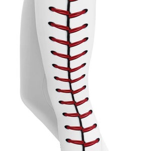 May include: White leggings with a baseball seam design. The leggings feature a vertical red seam detail down the side, mimicking the stitching of a baseball. The design is a unique athletic apparel.