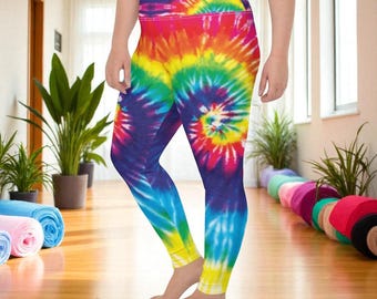 May include: Vibrant tie-dye leggings in a rainbow of colors, including red, orange, yellow, green, blue, and purple. The leggings feature a high waistband and a spiral pattern. The leggings are made of a soft, stretchy material.