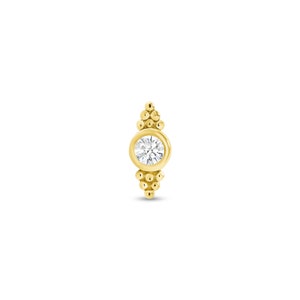May include: A gold nose ring with a round clear gemstone and a beaded design.