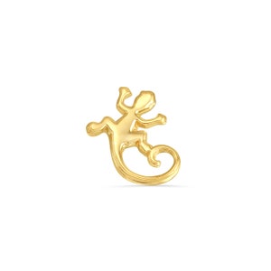 May include: A gold-colored lizard charm pendant. The lizard is depicted in a curled position with its tail curled around its body.