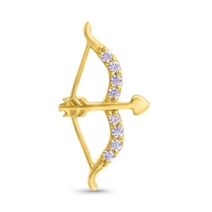 May include: A gold-coloured bow and arrow pendant. The bow is decorated with a row of small, clear gemstones. The arrow is positioned horizontally, pointing to the right. The design is a stylised representation of Cupid's bow and arrow.