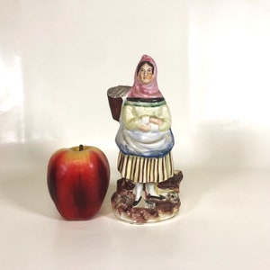 19th Century Figure of a Woman Carrying Basket