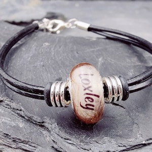 Leather bracelet with a pearl filled with hair, fur, ashes and name, animal hair jewelry, memorial jewelry, urn jewelry