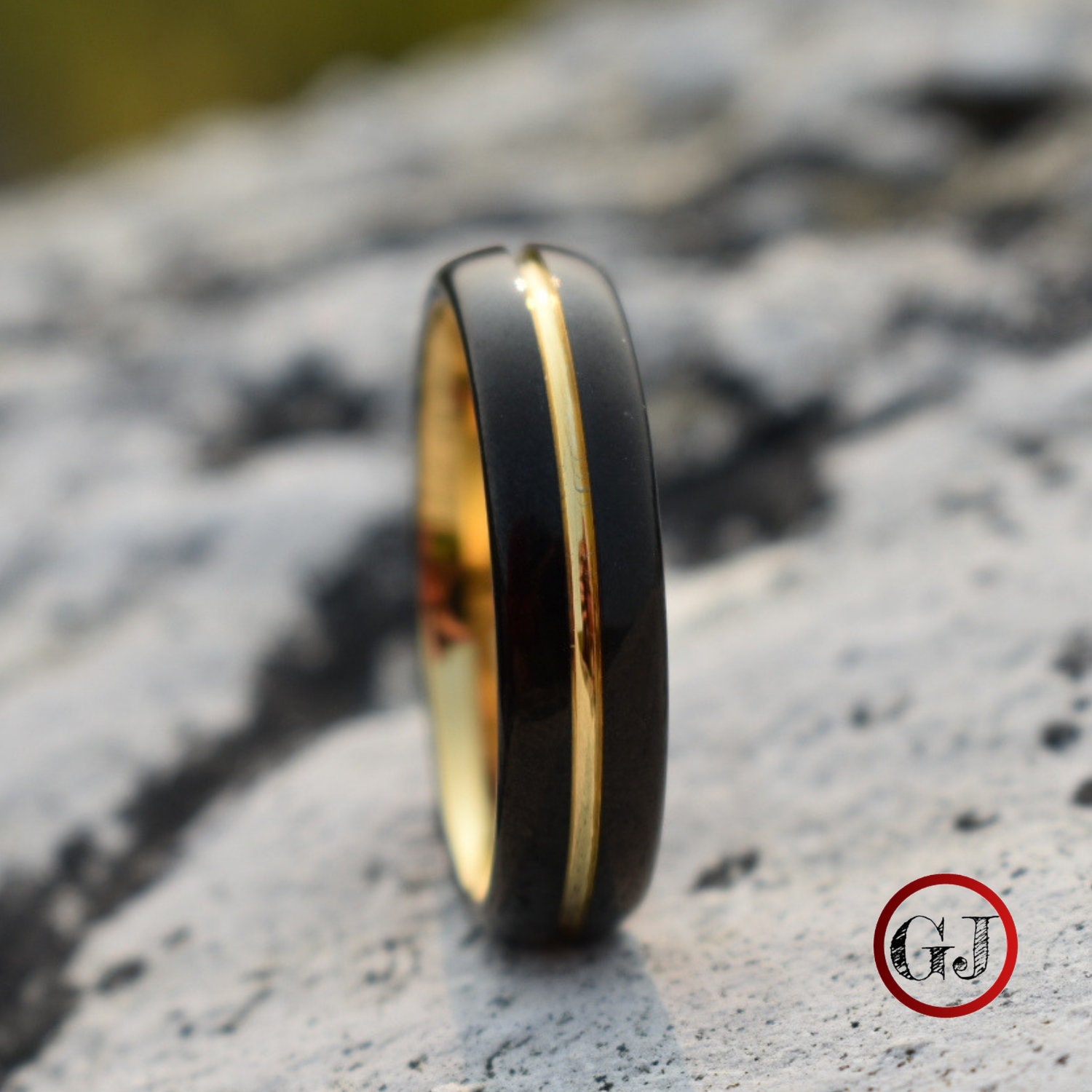 Black ring with gold stripe sale