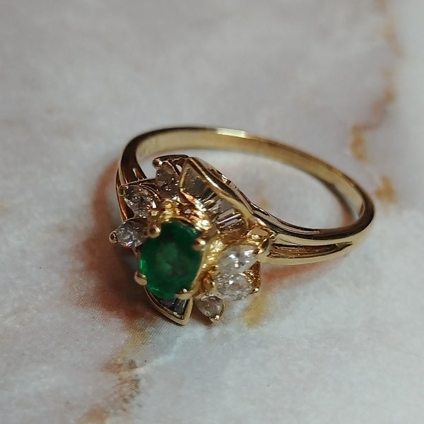 Stunning 1ct Vivid Green Emerald Ring, exquisitely framed by sparkling diamonds