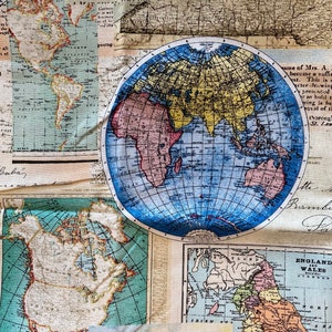 May include: A vintage map of the world with a blue globe in the center. The map is printed on a cream-colored fabric with a faded, antique look. The globe shows the continents in shades of pink, yellow, and green. The map includes text that reads "MAP OF THE WORLD".