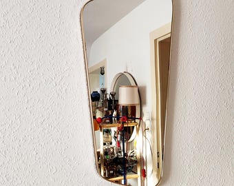 Kidney mirror, vintage West Germany, asymmetrical with brass band