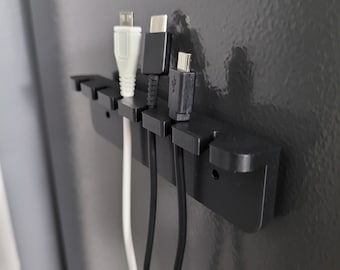 Staffa per la gestione del cavo - Organizzatore del cavo USB - Custodia per il cavo di ricarica del telefono