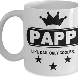 May include: White ceramic mug with the word "PAPP" in a black oval, topped with a black crown. Below the oval, the text reads "LIKE DAD. ONLY COOLER." Three black stars are below the text.