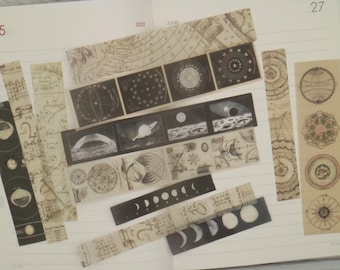 May include: Assortment of vintage-style washi tapes featuring celestial and astronomical designs. The tapes include images of planets, stars, moons, and constellations. The tapes are printed on a beige background with black ink.