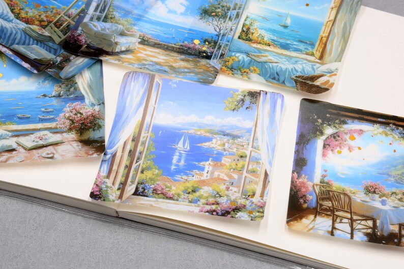 May include: Several decorative square art prints featuring coastal scenes with sailboats, open windows, and floral arrangements. The prints showcase a vibrant color palette of blues, whites, and greens, evoking a sense of tranquility and scenic beauty.