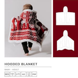 Peut inclure: Une couverture à capuche rouge et blanche avec un motif de rennes. La couverture est portée par un enfant. Le motif est un design scandinave traditionnel. La couverture est disponible en tailles bébé et adulte.