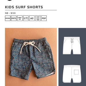 May include: A pair of blue and white patterned surf shorts for kids. The shorts have a drawstring waist and a pocket on the back. The shorts are shown on a brown background.