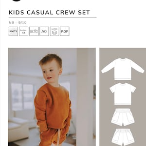 May include: A child's clothing pattern for a casual crew set. The pattern includes a long-sleeved shirt, a short-sleeved shirt, and two styles of shorts. The pattern is available in sizes NB - 9/10.