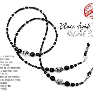 May include: Black agate beaded eyeglass chain with silver accents. The chain is made of black agate beads and silver beads. The chain is about 28 inches long. The chain is a great way to keep your glasses from falling off your face.