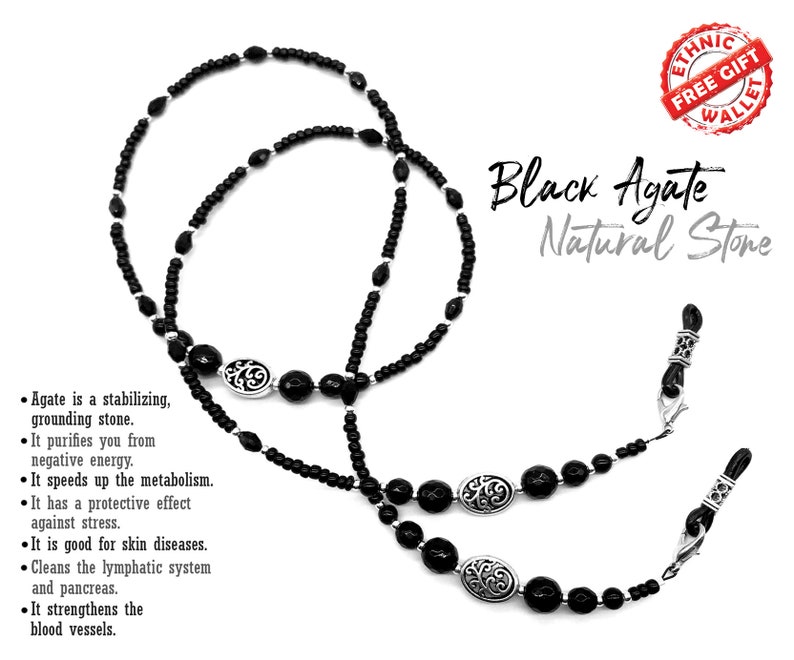 May include: Black agate beaded eyeglass chain with silver accents. The chain is made of black agate beads and silver beads. The chain is about 28 inches long. The chain is a great way to keep your glasses from falling off your face.