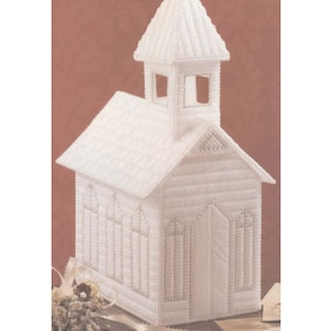 May include: White plastic craft kit to make a small church building. The church has a steeple and windows.