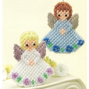 May include: Two handmade plastic canvas angel ornaments. One angel is white with pink wings and a light pink heart. The other angel is light blue with silver wings and a light pink heart. Both angels have a floral border with purple and blue flowers.